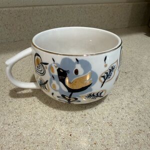 Anthropologie Corinna mug with a bird and floral pattern